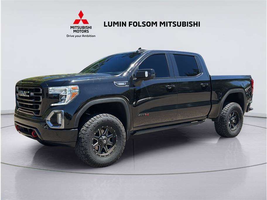 2021 GMC Sierra 1500 AT4 in Ebony Twilight Metallic — front three-quarter view