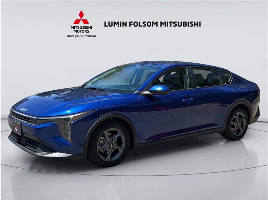 2025 Kia K4 LXS in Deep Sea Blue — front three-quarter view