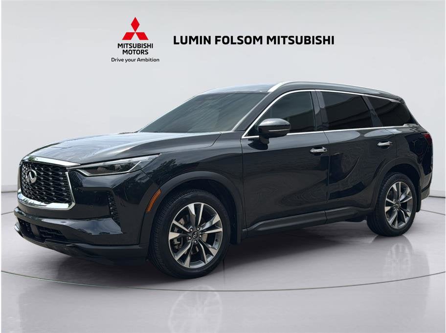 2023 INFINITI QX60 LUXE in Mineral Black — front three-quarter view