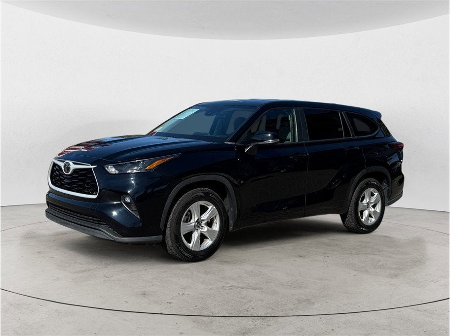 2023 Toyota Highlander LE Sport Utility 4D in Black — front three-quarter view