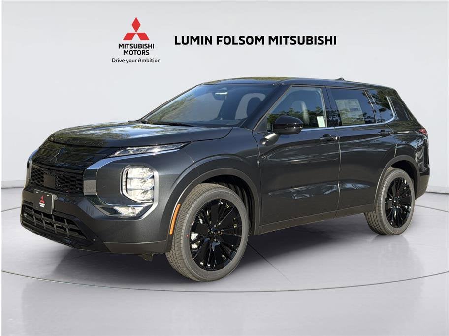 2026 Mitsubishi Outlander LE Sport Utility 4D in Graphite Gray — front three-quarter view