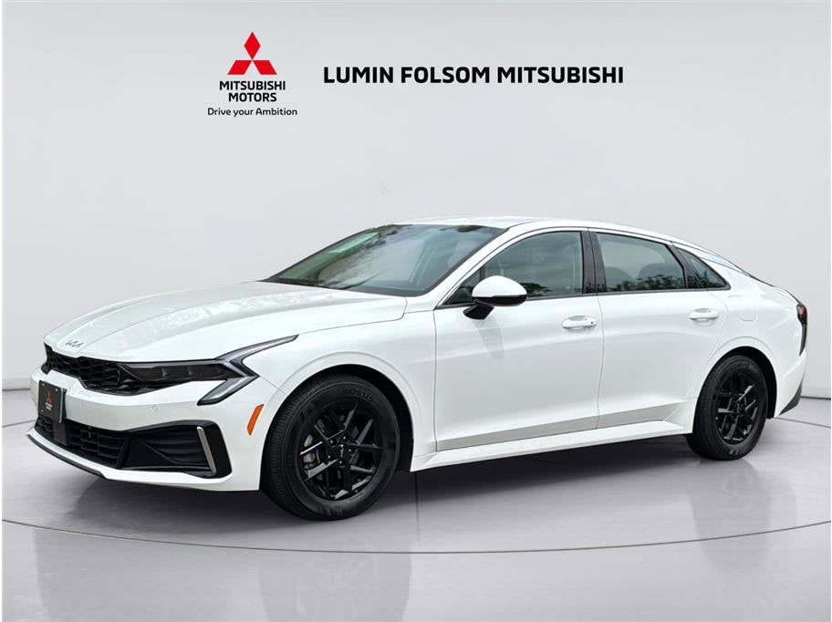 2025 Kia K5 LXS in Snow White Pearl — front three-quarter view