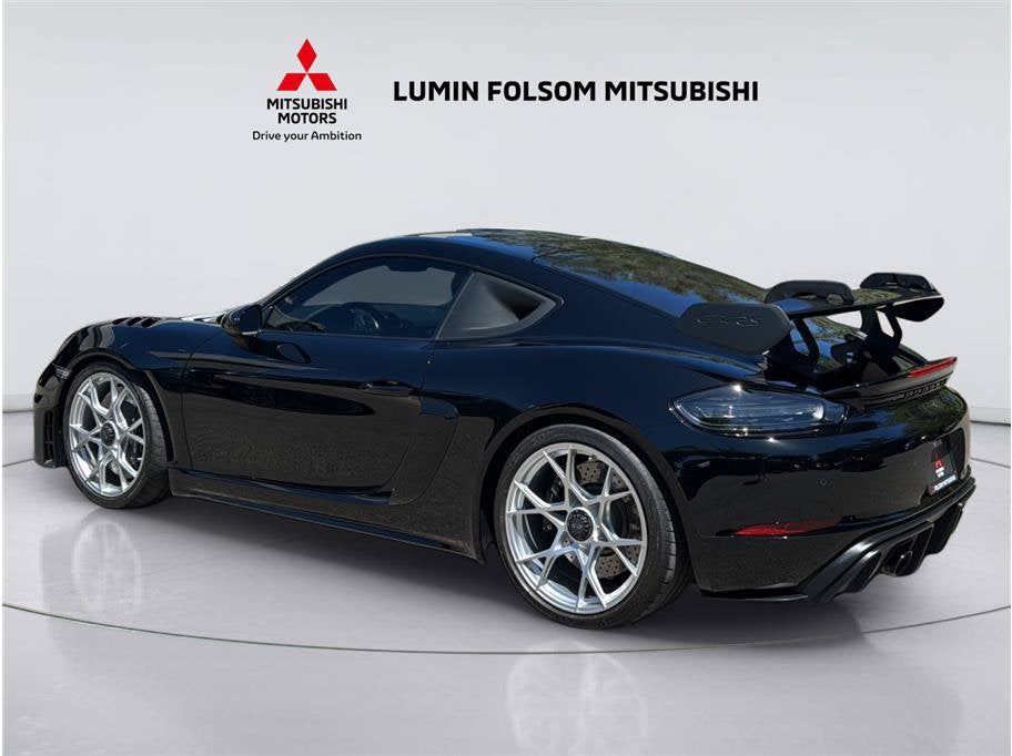 2025 Porsche 718 Cayman — rear three-quarter view