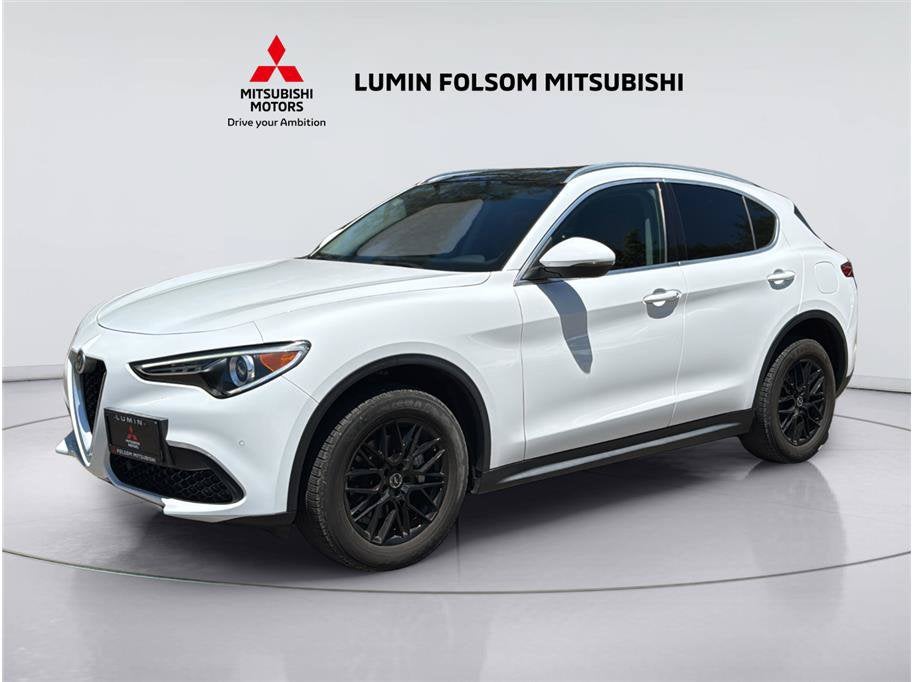 2019 Alfa Romeo Stelvio Sport Utility 4D in Alfa White — front three-quarter view
